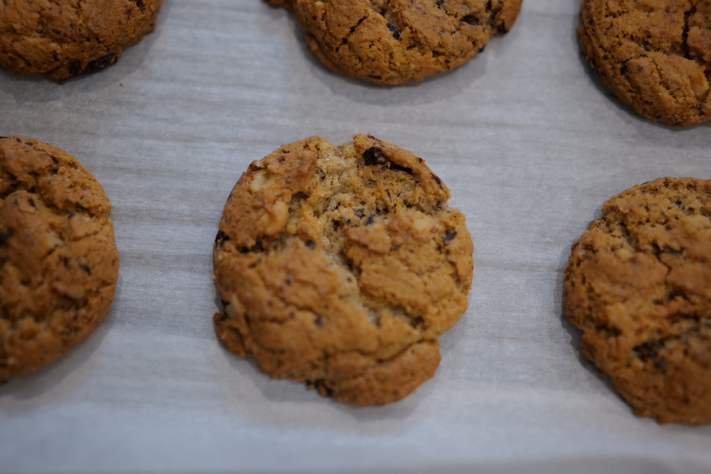 Cookies on a baking sheet with parchment paper